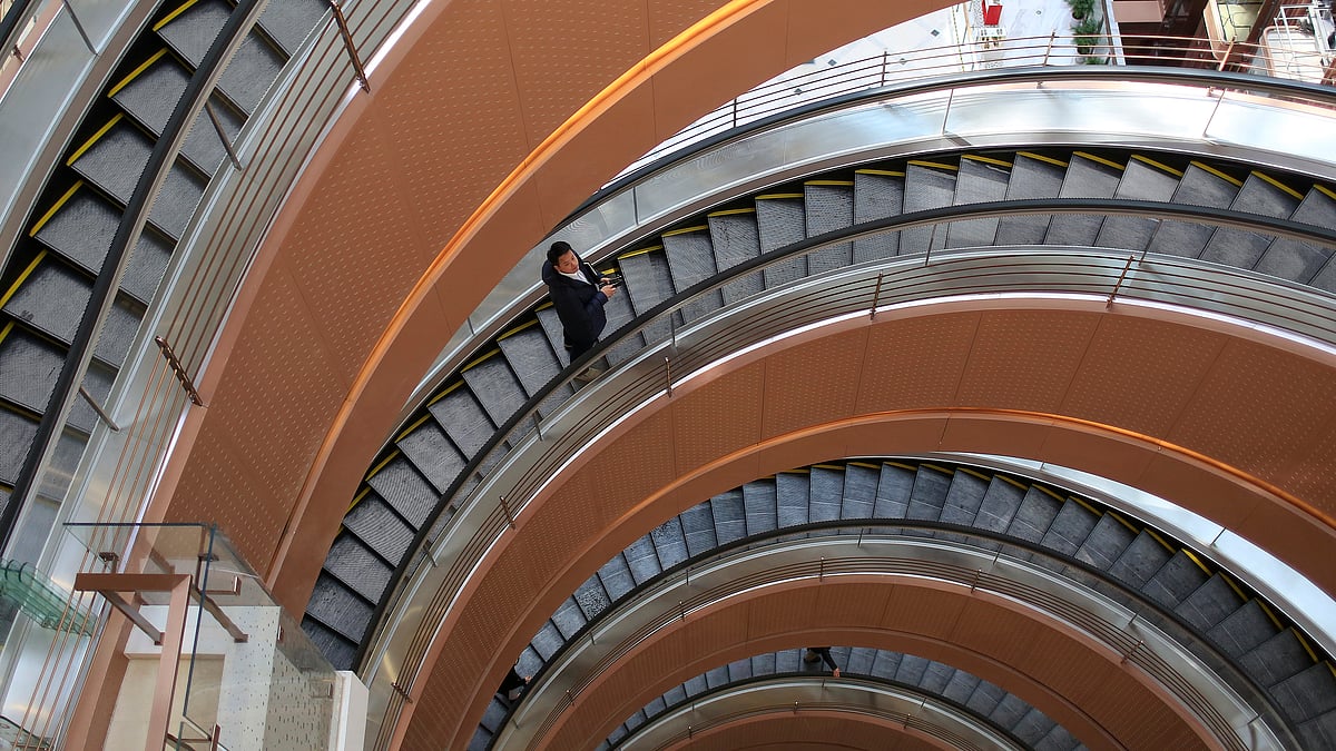 

A man rides a spiral elevator in a new shopping mall in Shanghai. (Photo: Reuters)