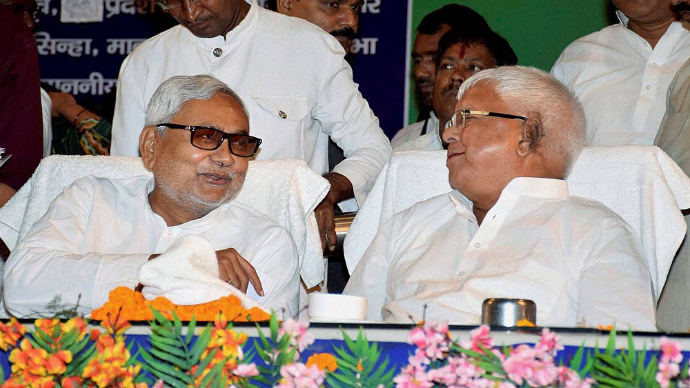 File photo of Bihar CM Nitish Kumar with RJD Chief Lalu Prasad Yadav. (Photo: PTI)