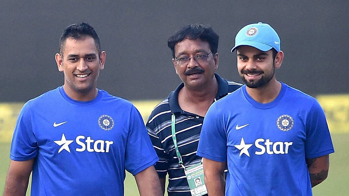 Indian Captain MS Dhoni and Virat Kohli inspect the pitch with the groundsman on the eve of the second T20 against South Africa at Barabati Stadium in Cuttack. (Photo: PTI)