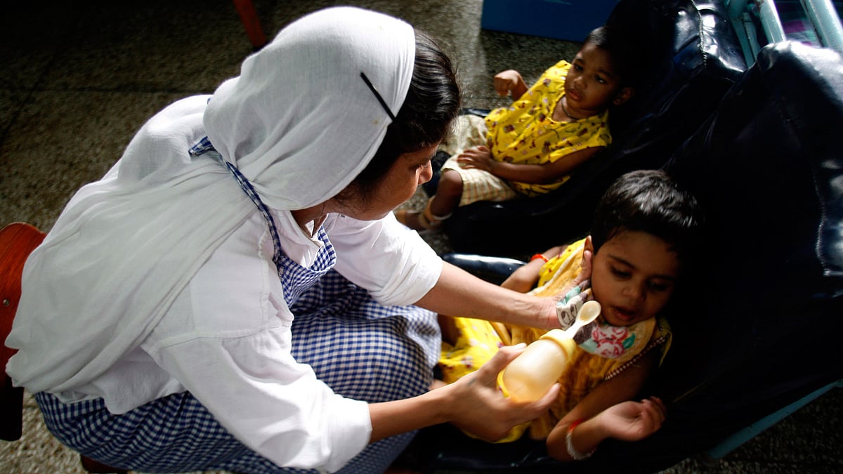 File picture of a nun belonging to the Missionaries of Charity feeding an orphan at “Shishu Bhavan”, Kolkata. (Photo: Reuters)