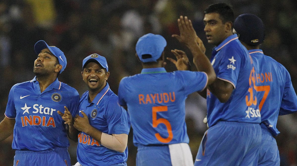 Indian players celebrate the wicket of Hashim Amla during their second Twenty20 in Cuttack. (Photo: AP)<a></a>