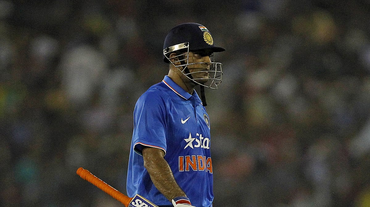 MS Dhoni walks off the field after being dismissed in the second T20 match against South Africa. (Photo: Reuters)