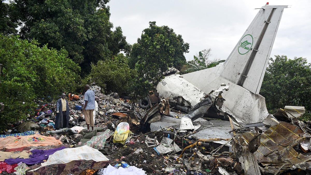 Rescuers pick through the wreckage of the cargo plane which crashed in Juba, South Sudan. (Photo: AP)