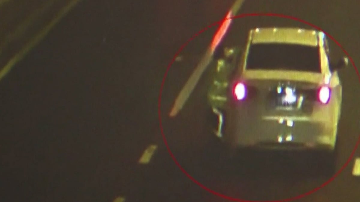This white car can be seen carrying a police officer crossing a couple of junctions among traffic. (Photo: AP screengrab)