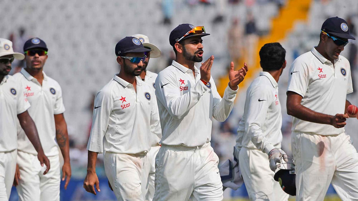 Virat Kohli leads his team off the field after bowling South Africa out for 184 on day 2 of the Mohali Test. (Photo: Ron Gaunt / BCCI / SPORTZPICS)