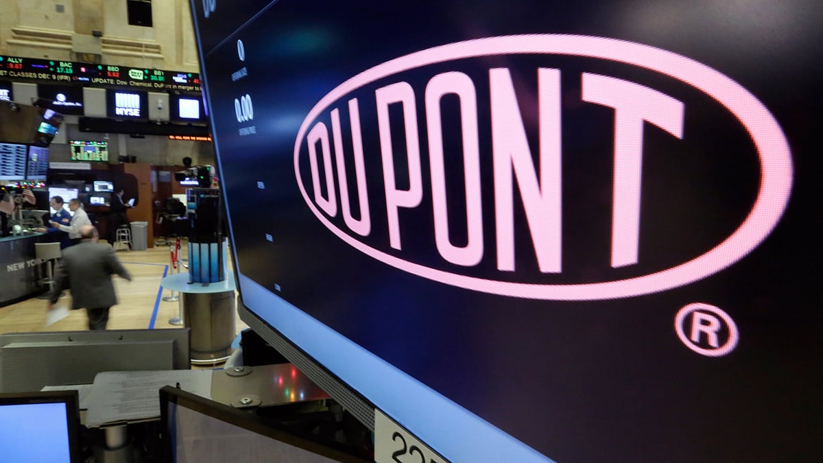 The company name of Dupont appears above its trading post on the floor of the New York Stock Exchange (Photo: AP)