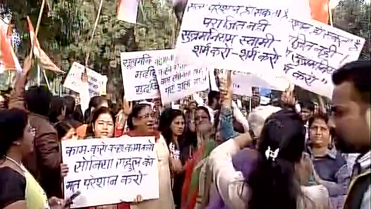 Congress workers protest after Parliament’s adjournment due to constant uproar over the allegations against Sonia and Rahul in the National Herald case. (Photo: ANI)