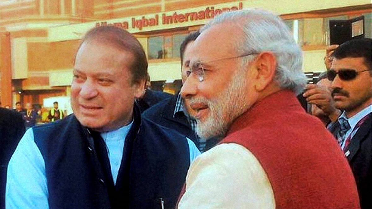 Prime Minister Narendra Modi is greeted by his Pakistani counterpart Nawaz Sharif on his arrival in Lahore on Friday. (Photo: PTI)