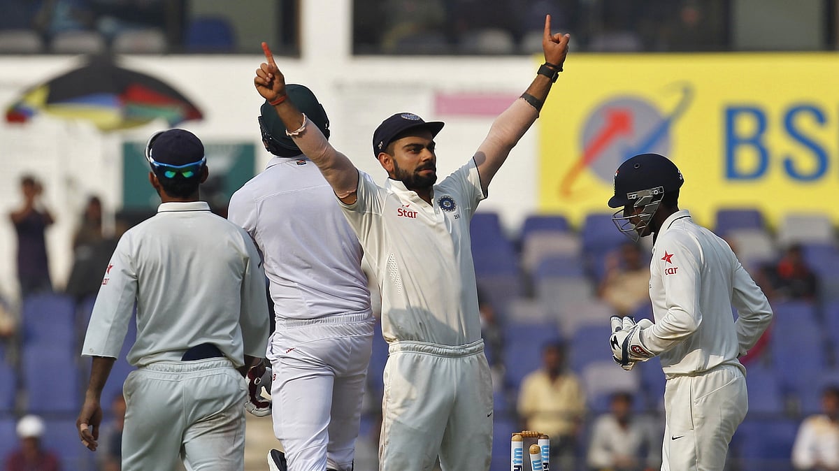 Virat Kohli raises his arms after winning the third test at Nagpur. (Photo: Reuters)