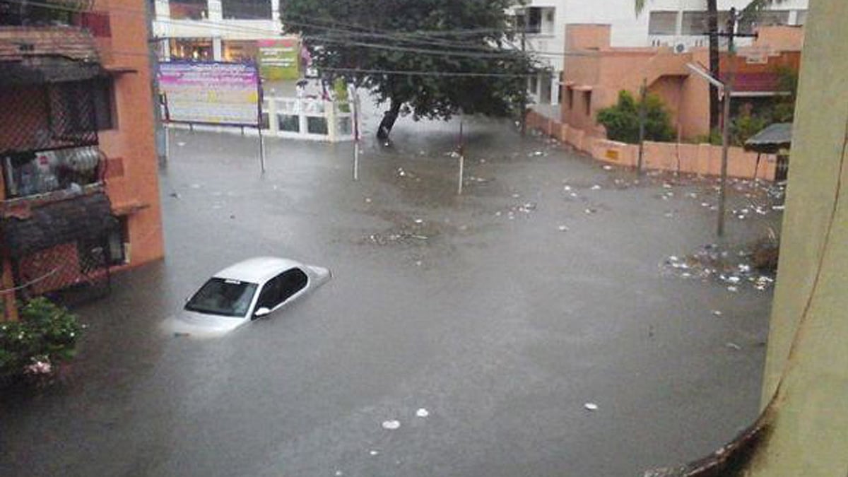 A drowned car during Chennai rains. (Photo: PTI)
