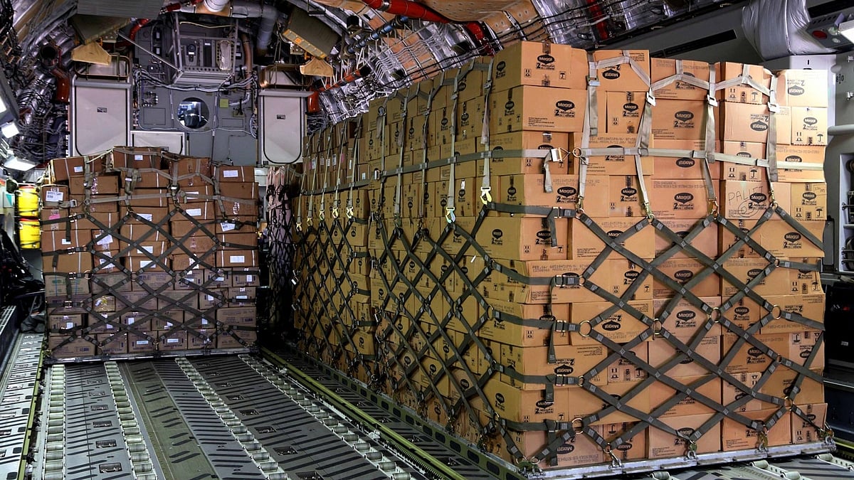 An IAF C-17 Globemaster-III being loaded at Air Force Station Palam with relief material containing 25 tonnes of food and medicines for cyclone-struck Fiji. (Photo: IANS) 