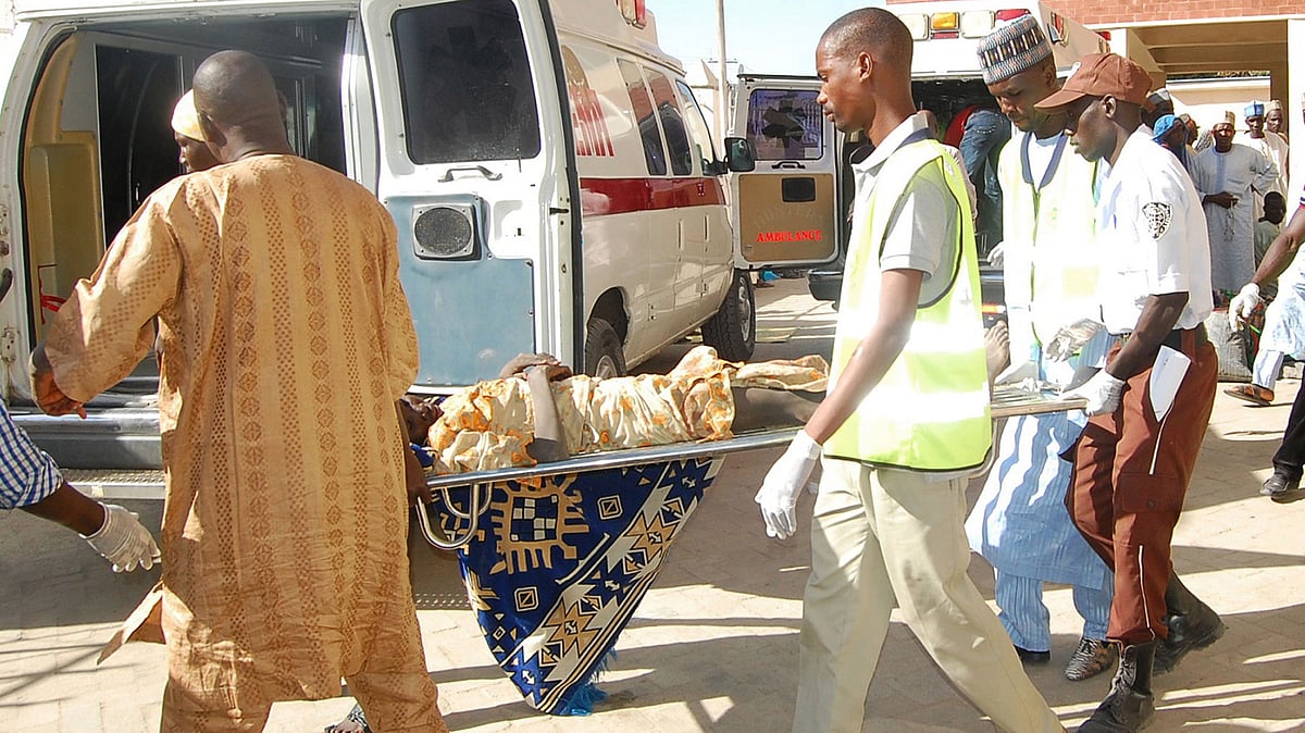 Rescue workers transport a victim of a suicide bomb attack at a refugee for treatment at a hospital, in Maiduguri, Nigeria. (Photo: AP)  &nbsp;