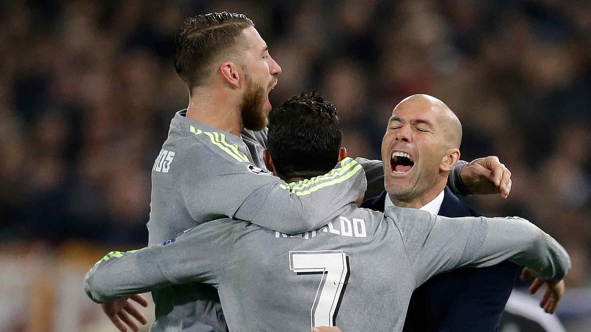 Ronaldo, Ramos and Manager Zidane celebrate the opener against AS Roma. (Photo: AP)