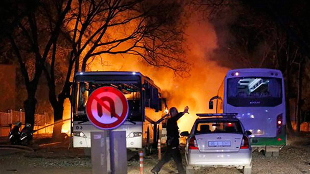 A police officer clears the area of an explosion in Ankara. (Photo: AP)