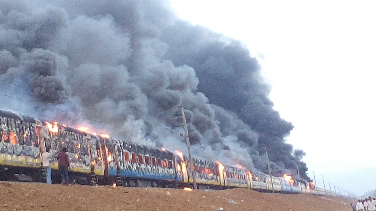 Protestors belonging to Kapu caste set a train on fire and blocked rail and road traffic in East Godavari district on 31 January 2016. (Photo: IANS)