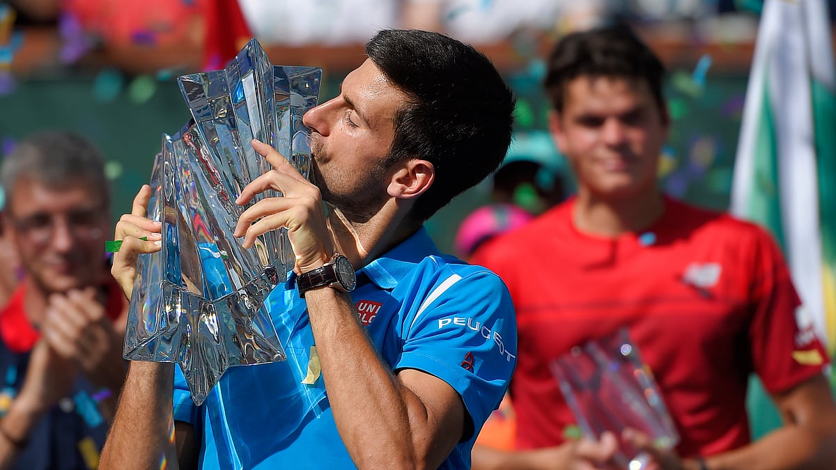 Novak Djokovic kisses the BNP Paribas Open trophy after beating Milos Raonic in the final. (Photo: AP)