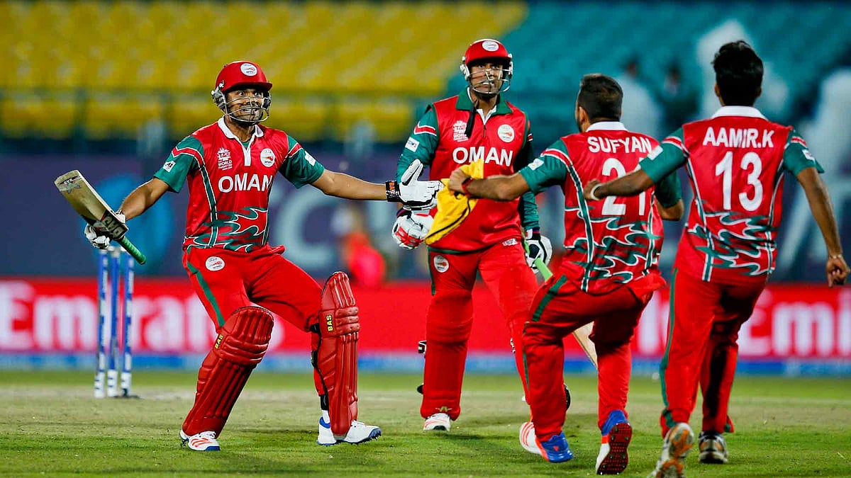 Oman’s players celebrate after winning the ICC World Twenty20 match against Ireland at the Himachal Pradesh Cricket Association (HPCA) stadium in Dharamsala. (Photo: AP)