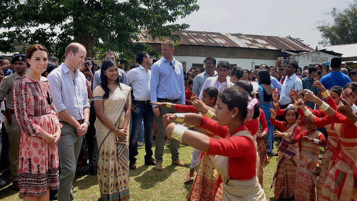 Prince William, Duke of Cambridge and his wife Catherine (Kate), Duchess of Cambridge being welcomed by village women. (Photo: PTI)
