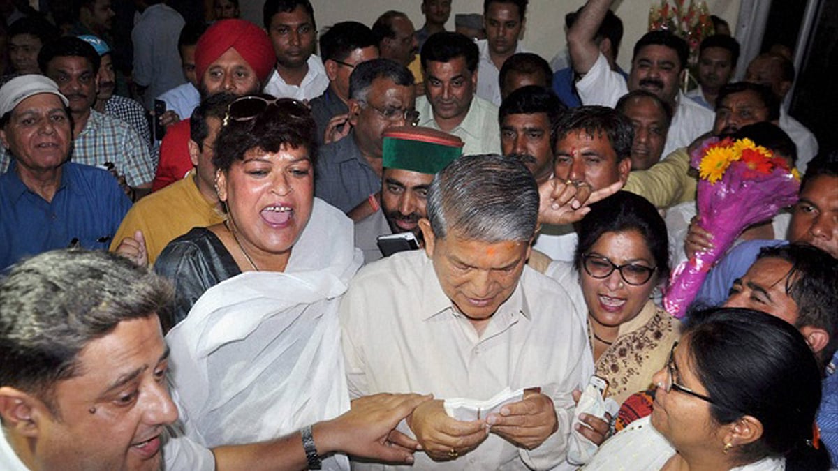 Reinstated CM Harish  Rawat along with Congress supporters celebrate the Uttarakhand HC’s  verdict. (Photo: PTI)