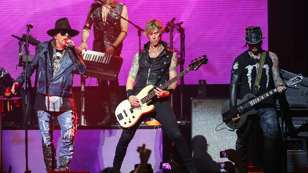  In this April 23, 2014 file photo, Axl Rose, from left, Duff McKagan and DJ Ashba of Guns N’ Roses perform on stage at the 6th Annual Revolver Golden Gods Award Show at Club Nokia in Los Angeles. (Photo: AP)