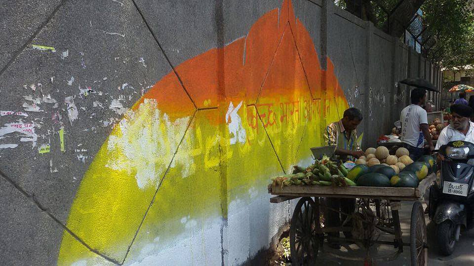Shabbu and Swen were forced to paint “Swachh Bharat” and “Narendra Modi” in hindi over their Urdu couplet. (Photo Courtesy: <a href="https://www.facebook.com/Delhiiloveyou/?fref=ts">DILY</a>)