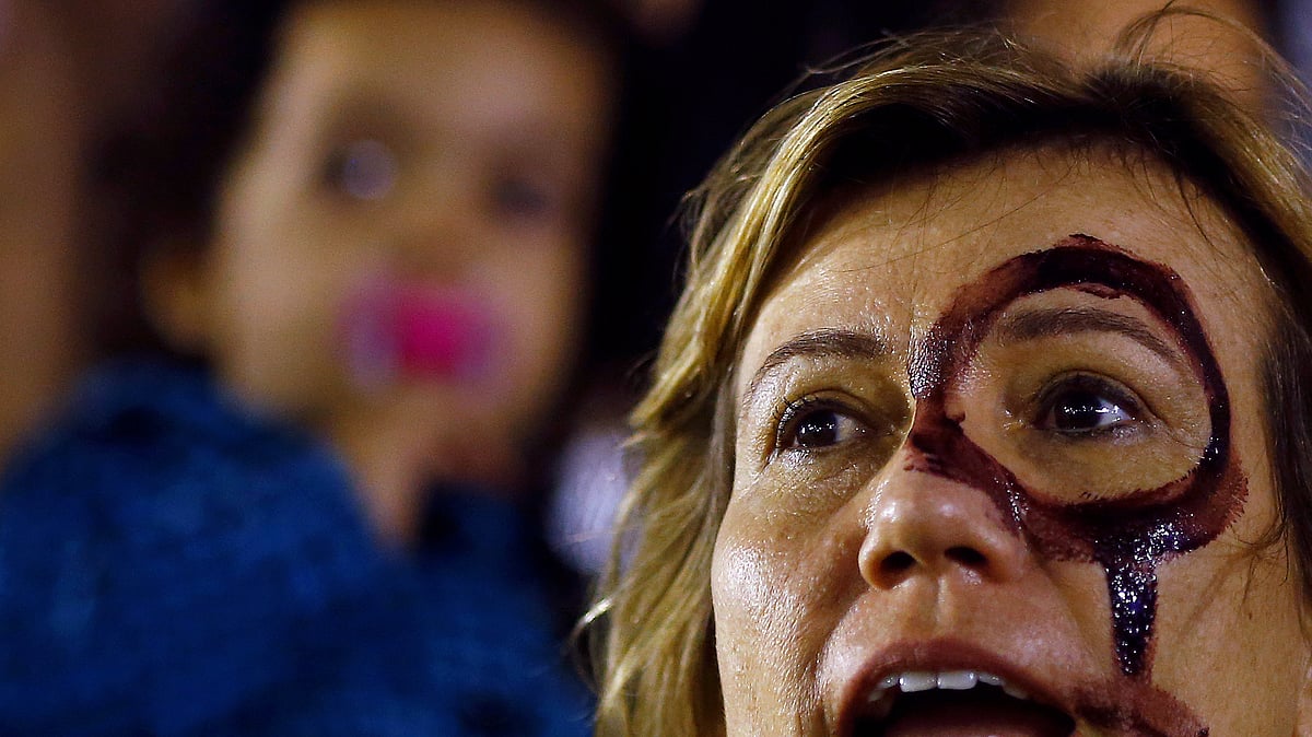 A woman attends a protest against rape and violence against women in Rio de Janeiro. (Photo: Reuters)