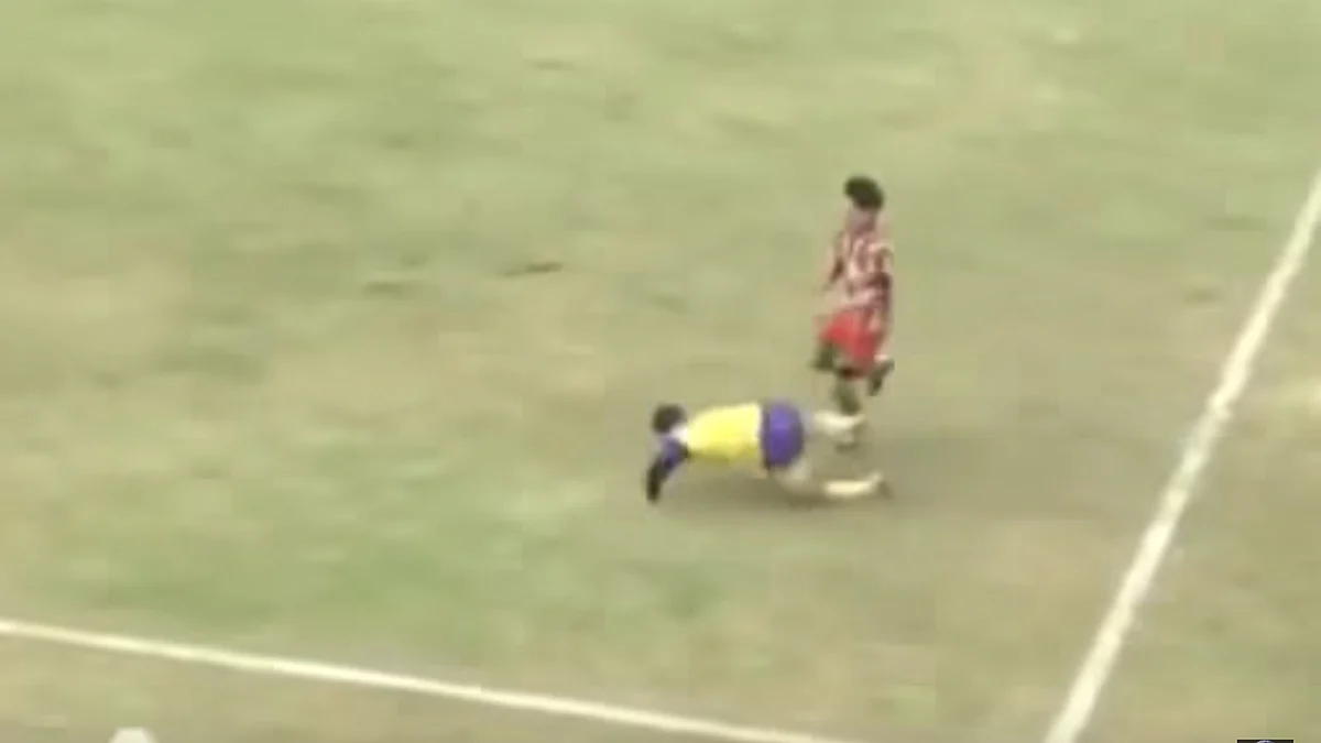 Michael Favre (left) falls on the field. (Photo: YouTube Screenshot)