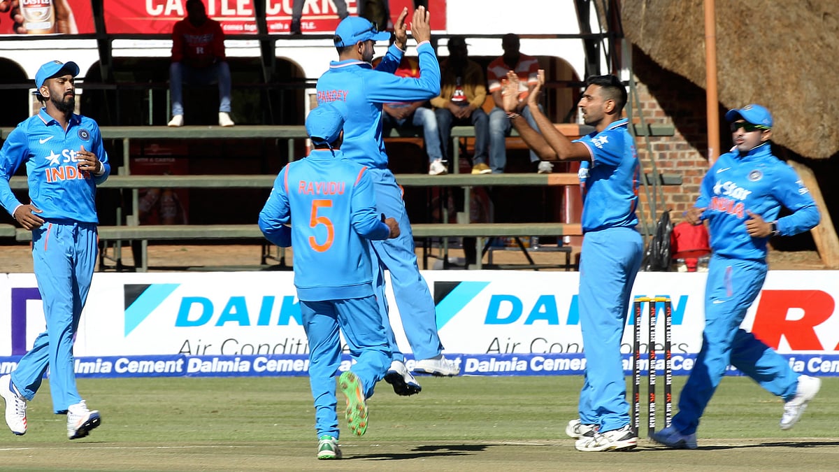 Dhawal Kulkarni celebrates a wicket with his teammates. (Photo: AP)