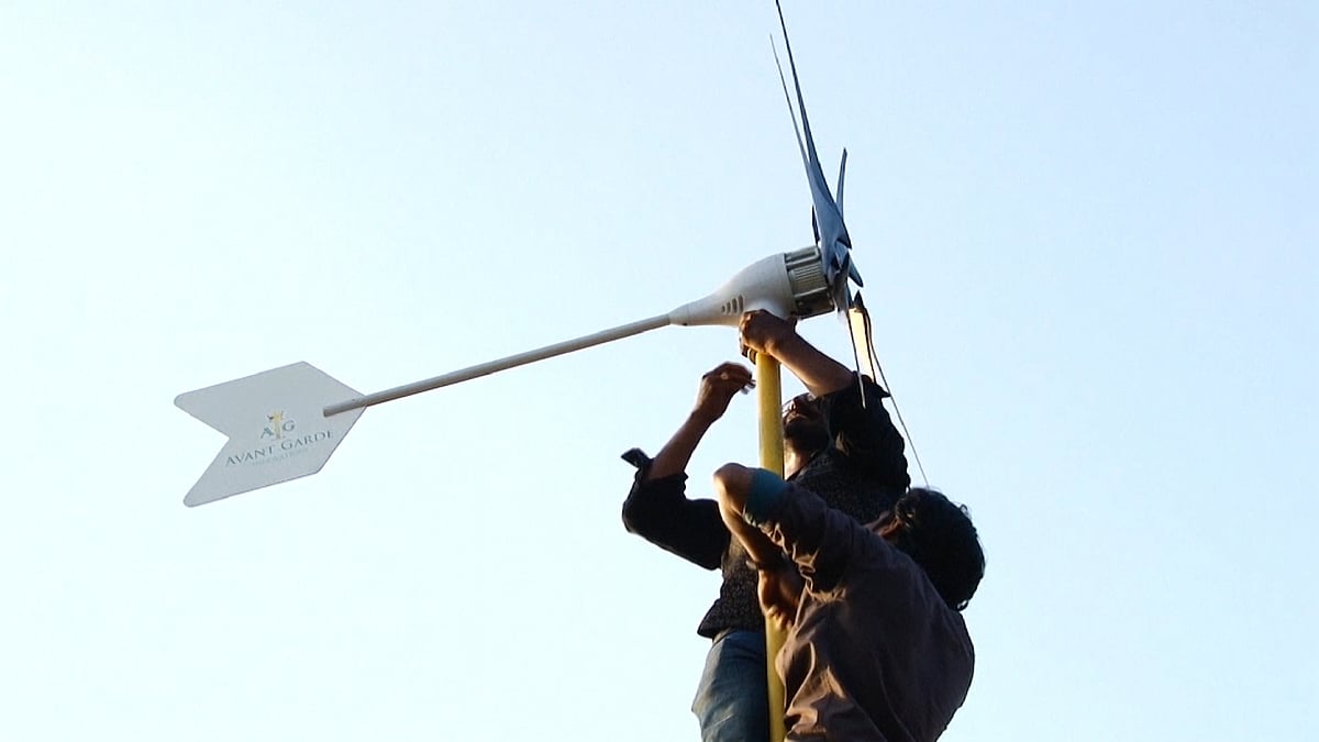 Brothers Arun and Anoop George at work at their wind farm in Kerala. (Photo: AP screengrab)