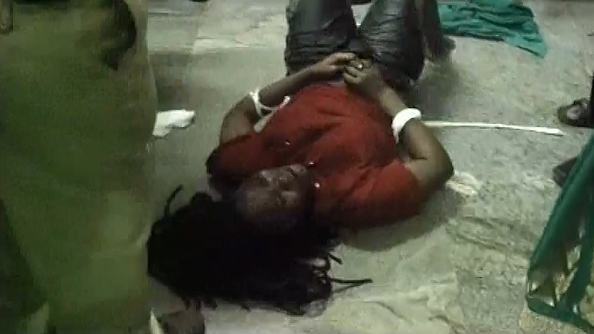 Nigerian woman named Namplima Marian tied using rope by the Bengaluru police. (Photo: ANI screengrab)