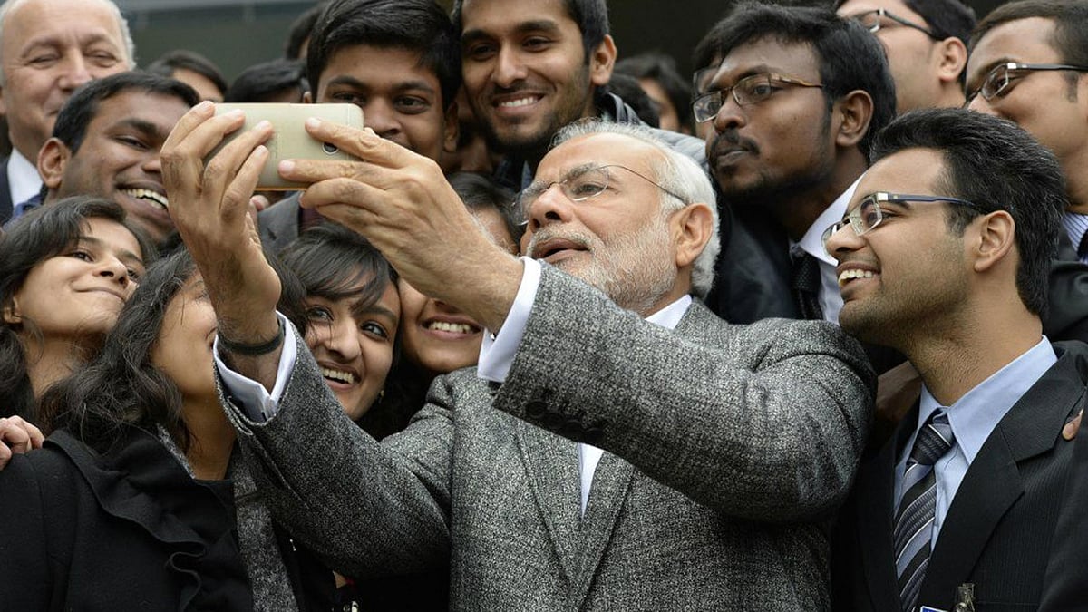 File photo: Prime Minister Narendra Modi clicks a selfie. (Photo Courtesy: Twitter/<a href="https://twitter.com/Kractivist/status/673036267492274176">@Kractivisit</a>)