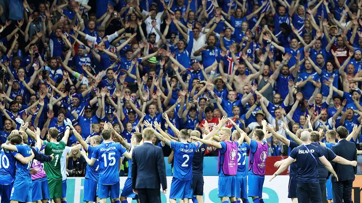 Iceland football team celebrate with fans after defeating England. (Photo: AP)