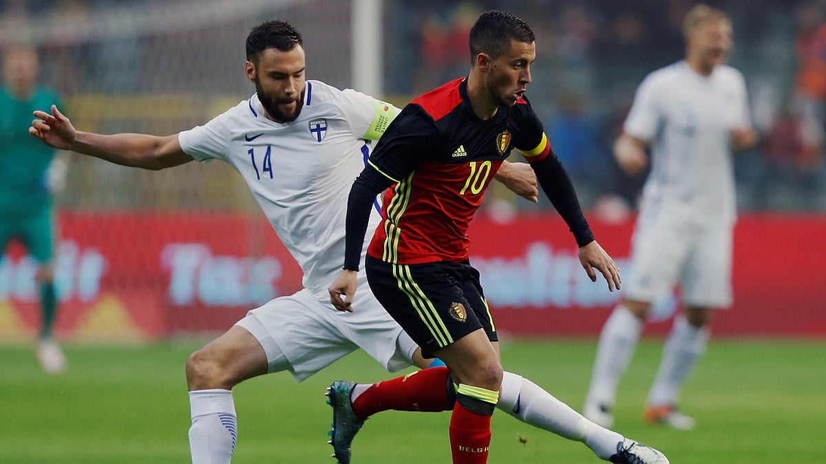 Belgium’s Eden Hazard (R) in action with Finland’s Tim Sparv during a friendly game. (Photo: Reuters)
