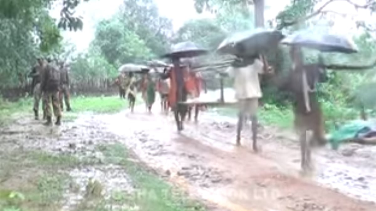 Villagers carrying dead bodies after five people were killed in a cross firing in Odisha. (Photo Courtesy: YouTube screengrab)