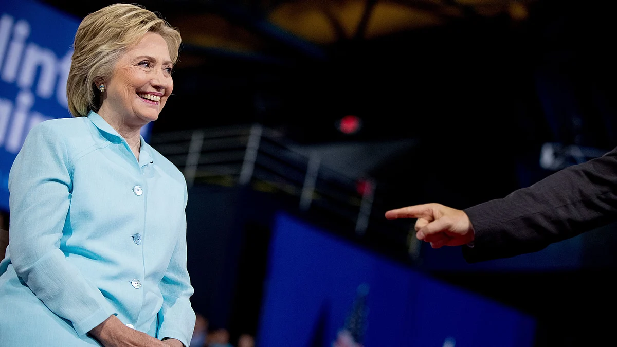 Senator Tim Kaine, D-Va, left, points at Democratic presidential candidate Hillary Clinton, left, as he speaks at a rally at Florida International University (Photo: AP)