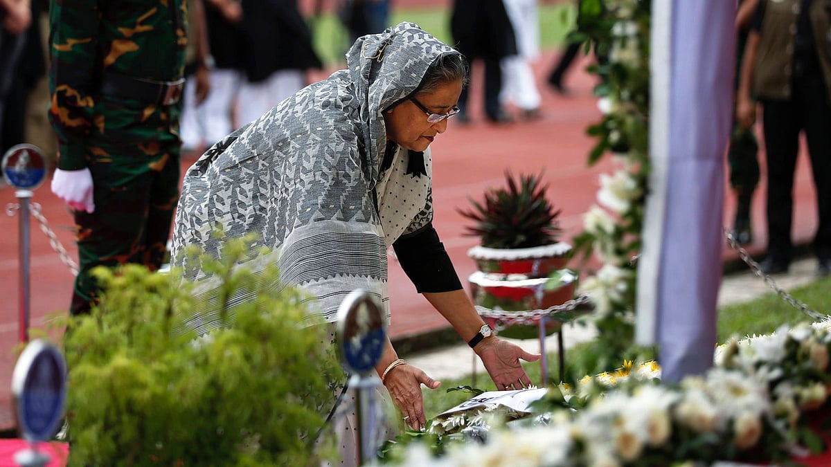 Bangladesh Prime Minister Sheikh Hasina pays respect to the victims of the Dhaka terror attack last week. (Photo: AP)