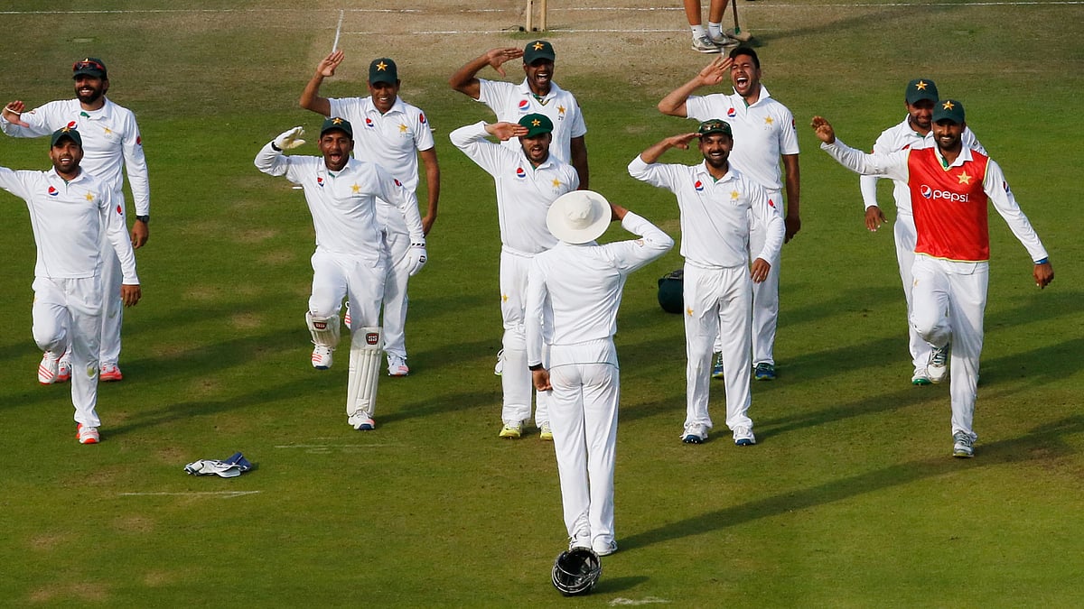 Members of the Pakistan cricket team celebrate after winning the Lord’s Test. (Photo: Reuters)