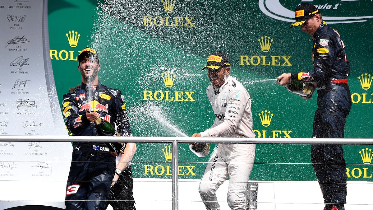 Mercedes Driver Lewis Hamilton (center) celebrates after winning the German grand Prix on Sunday. (Photo: AP)