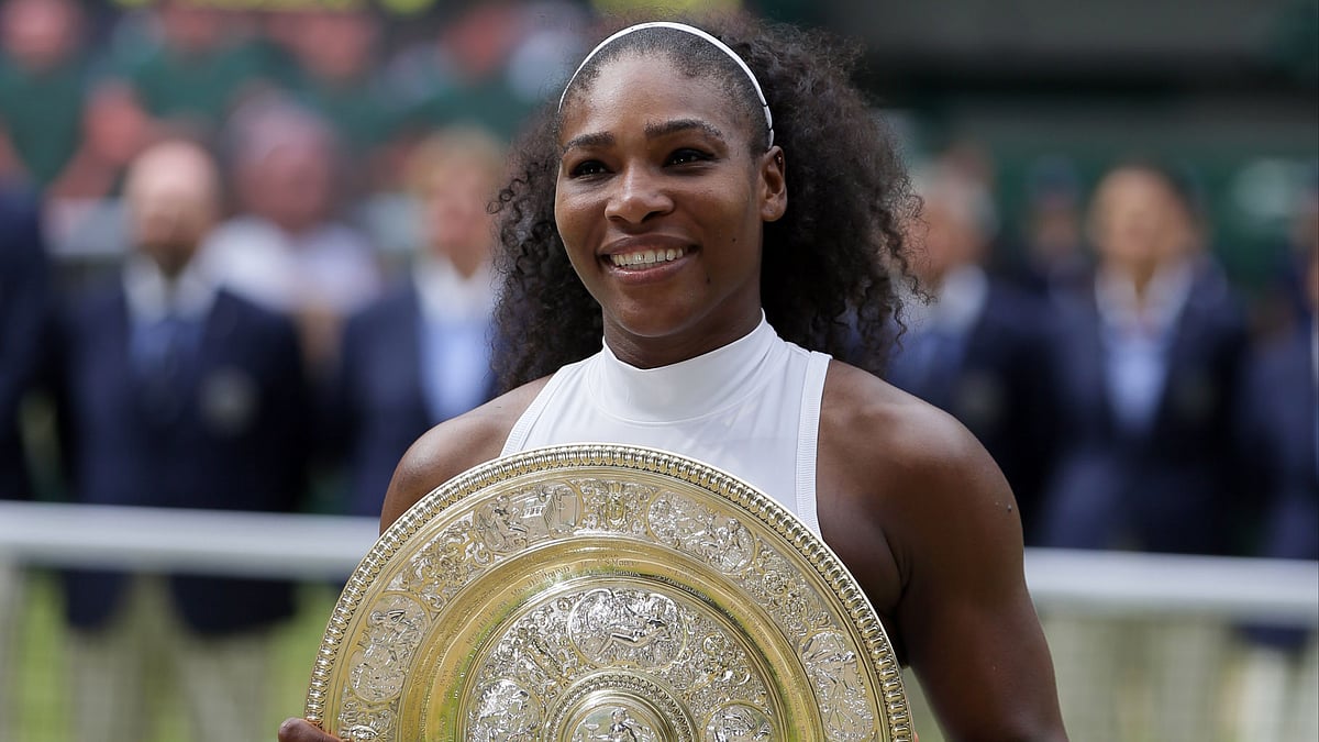 Serena Williams poses with the Venus Rosewater Dish. (Photo: AP)