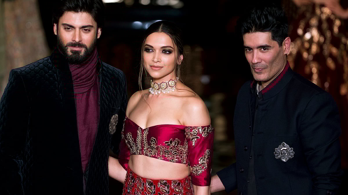 Deepika Padukone , Fawad Khan and Manish Malhotra on the first day of the fashion week. (Photo : AP)