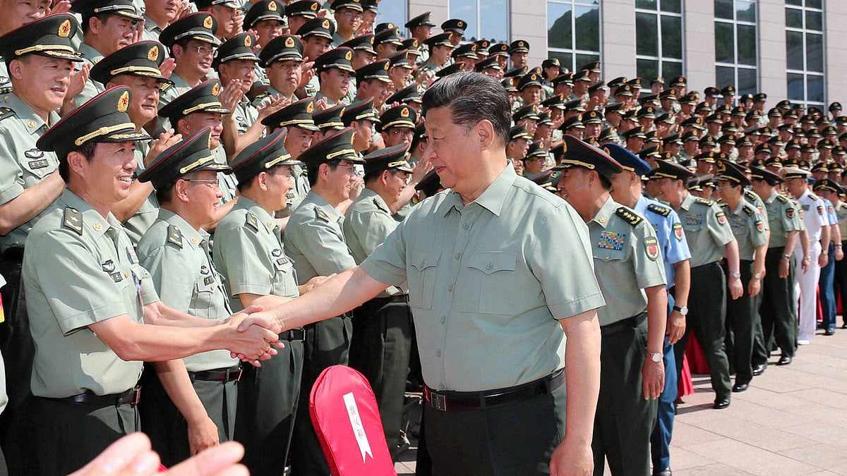 Chinese President Xi Jinping shaking hands with military delegates attending a conference of Communist Party members of Chinas Peoples Liberation Army (PLA) during an inspection tour. (Photo: PTI)