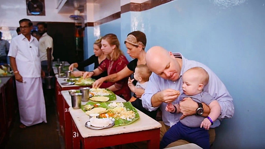 South Indian meal enjoyed as it should be. (Photo courtesy: YouTube)