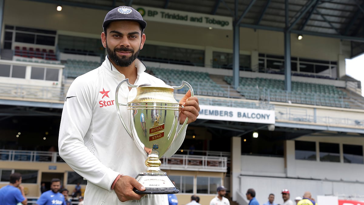 Indian test skipper Virat Kohli holds the trophy after India clinched the four-match-test series against West Indies 2-0. (Photo: AP)