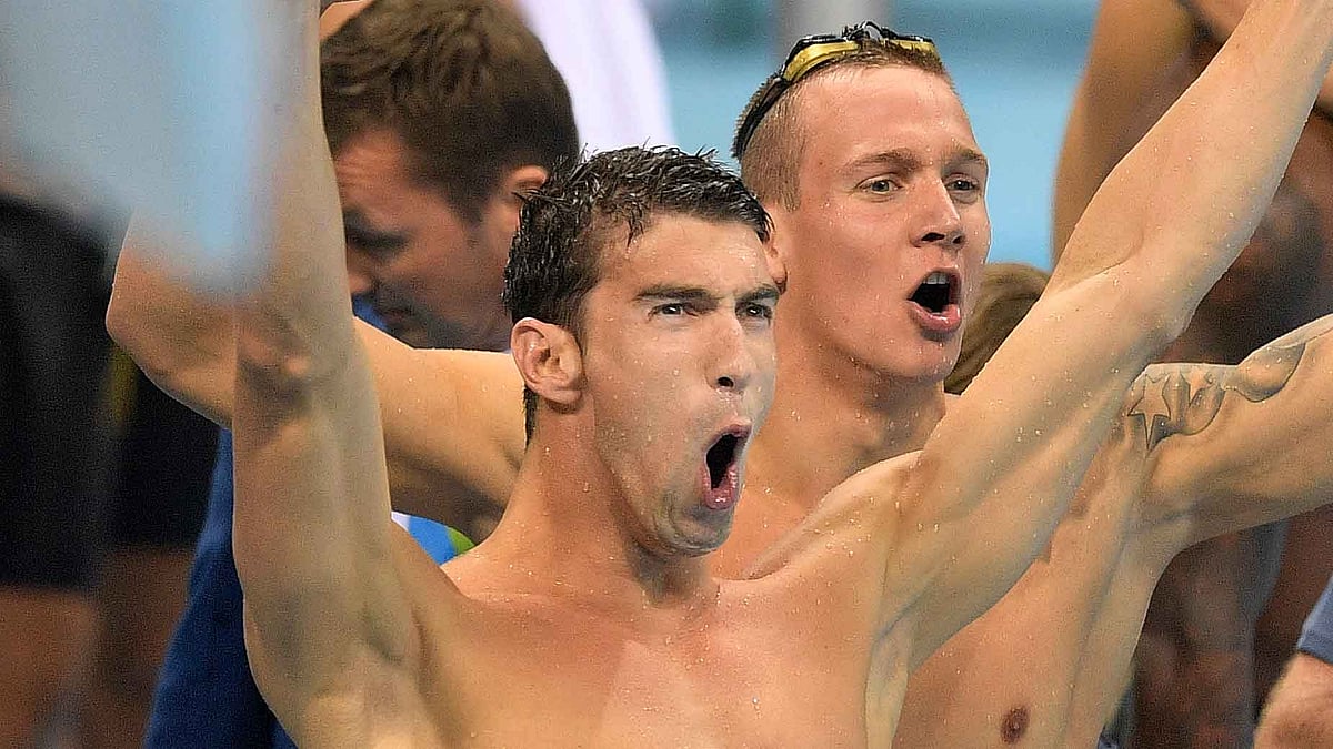 Michael Phelps celebrates after Team USA win the gold medal. (Photo: AP)