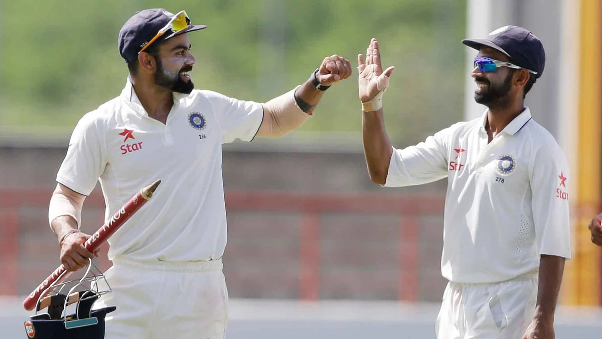 Virat Kohli celebrates with Ajinkya Rahane after India won the third Test against West Indies. (Photo: AP)
