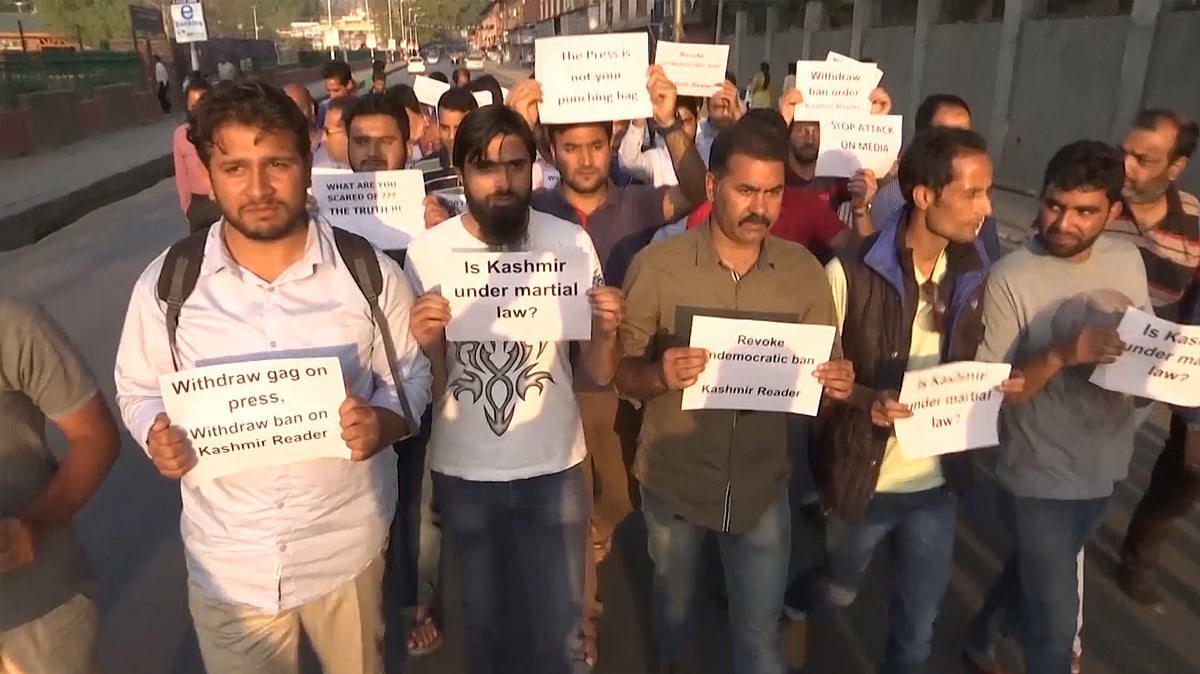 Journalists and civil society members hold a protest in Srinagar on Wednesday. (Photo: AP Screengrab)