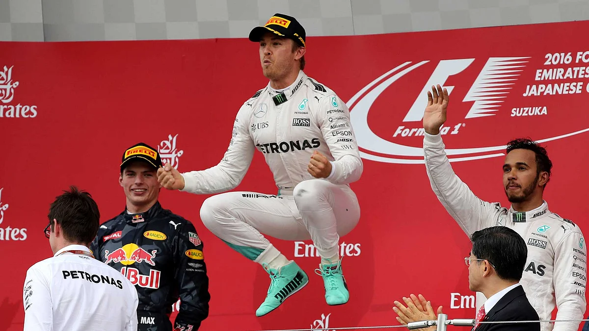 Mercedes driver Nico Rosberg, centre, of Germany celebrates on the podium after winning the Japanese Formula One Grand Prix at the Suzuka International Circuit in Suzuka, Japan. (Photo: AP)