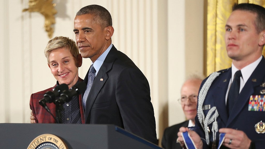 

President Barack Obama puts his arms around actress, comedian, and talk show host EllenDeGeneres, as she is presented the Presidential Medal of Freedom. (Photo: AP)