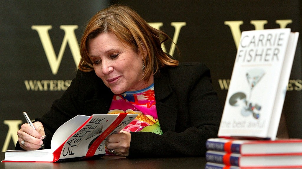  Carrie Fisher signs her new book “The Best Awful” at a promotional event in London. (File Photo: AP)