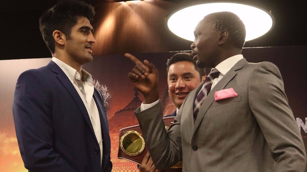 Vijender Singh with Francis Cheka during a press conference in New Delhi. (Photo: IANS)